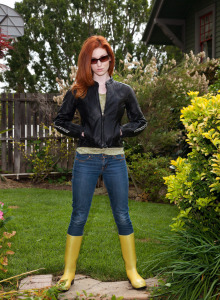 Redhead Emily Archer is in the garden wearing tight denim jeans